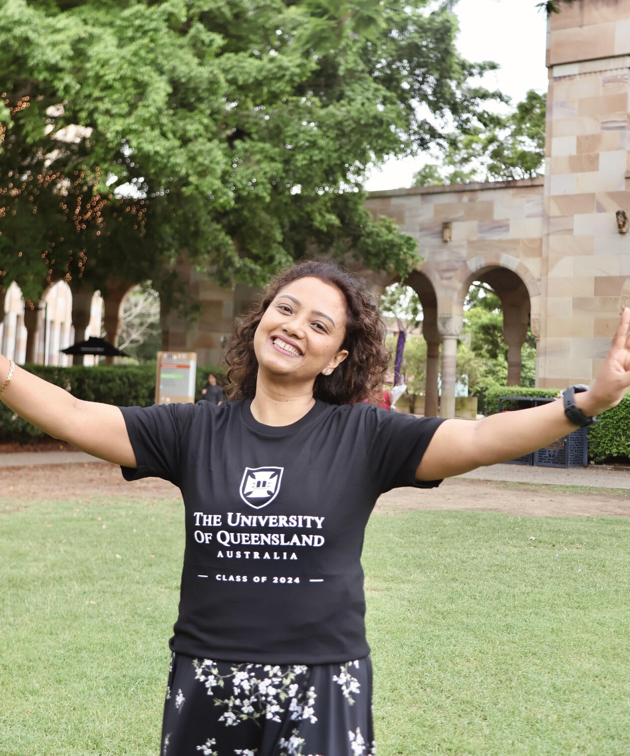 Sanjana Shrestha in UQ's Great court, wearing a black UQ t-shirt which reads "Class of 2024"