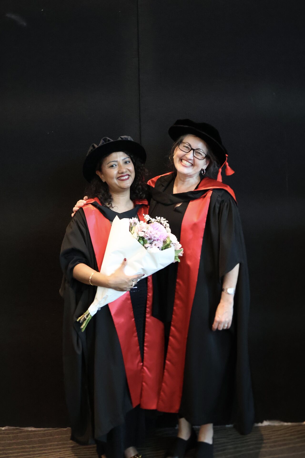 Sanjana Shrestha in her robes at her graduation ceremony